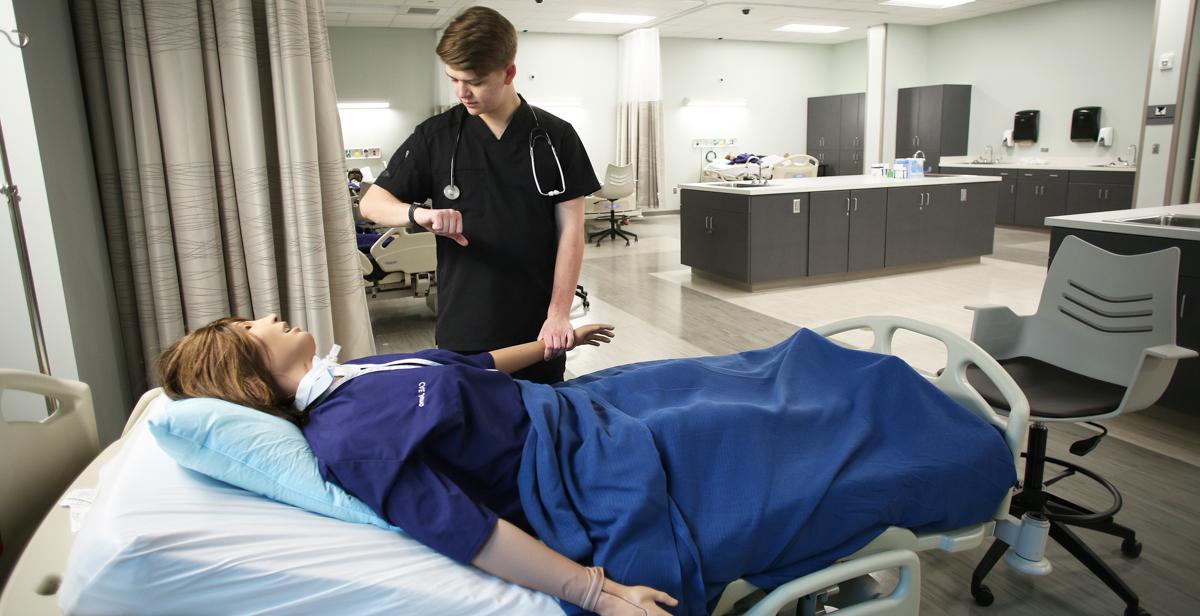 Will Rayner, a professional health sciences major from Hoover, Ala., practices on one of the high-tech patient simulators in the new, 39,000-square-foot Simulation Building. The facility is used by South's nursing, allied health and medical students. 